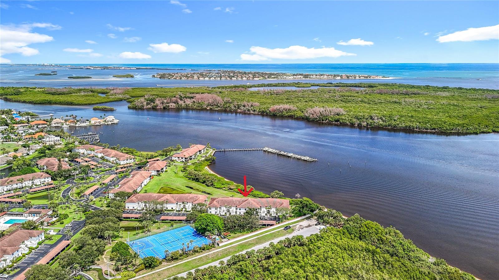 SPECTACULAR VIEWS OF THE INTRACOASTAL WATERWAY! Renovated 2/2 - Penthouse Unit with VAULTED CEILINGS* IMPACT GLASS Enclosed Balcony & Accordion Hurricane Shutters Throughout* Skylight in Kitchen & Master Bath Suite* Plantation Shutters* Luxury Wood Cabinets in Kitchen w/Soft Close Drawers & Granite Countertops* Full Size Washer & Dryer* Attic Access Storage w/Pull Down Ladder* Exterior Storage in Building* Carport* Maintenance Fee Includes Building Insurance, Roof Maintenance, Landscaping, Clubhouse Amenities, Heated Pool, Jacuzzi, Tennis, Pickleball, Barbecue Grills, Cable & Internet. *ENJOY WATERFRONT LIVING WITH MAGNIFICANT VIEWS* Boat Docks Available for Sale/Lease* NO Fixed Bridges* Boaters' Paradise!!
