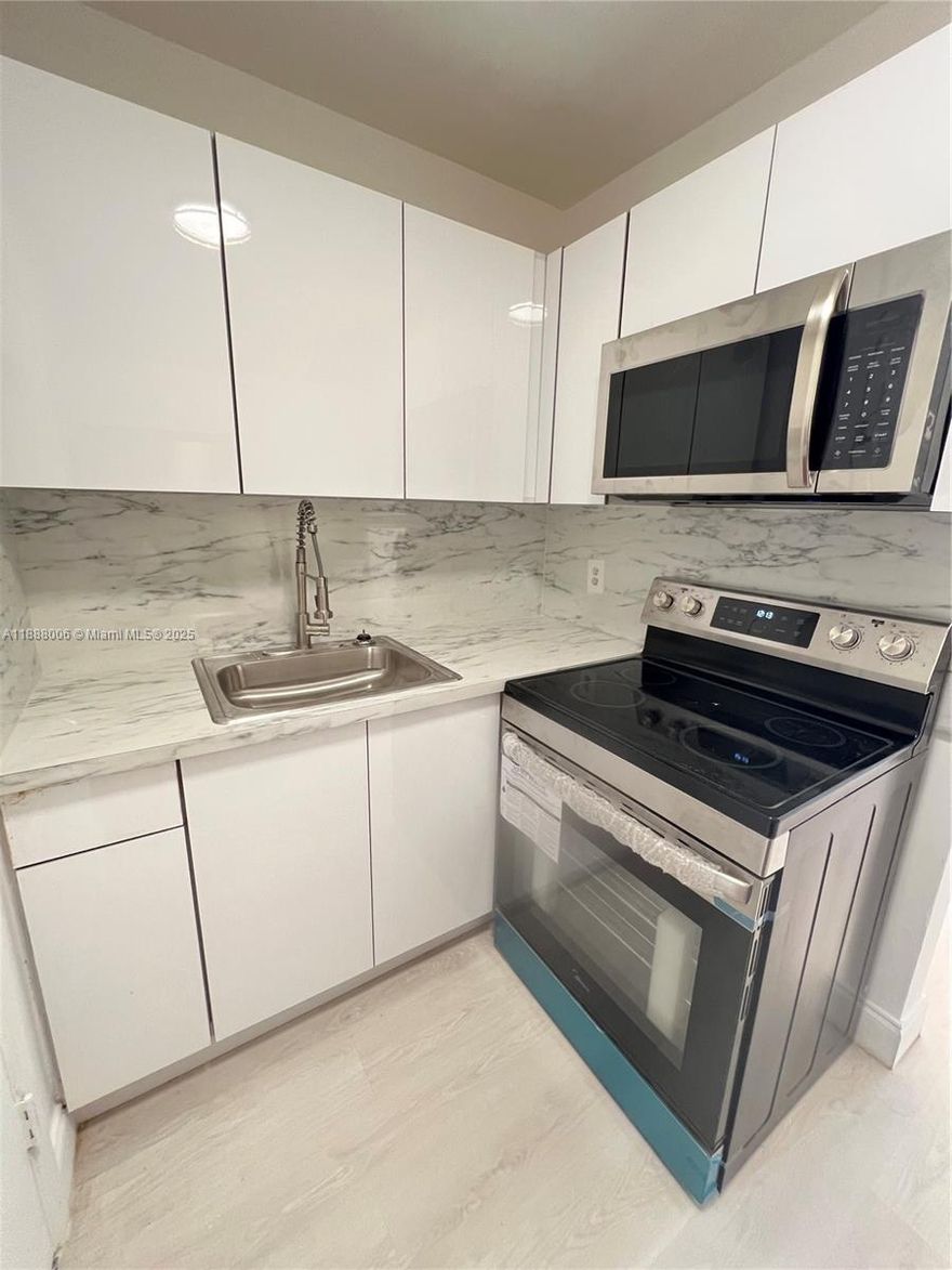 NO AGE RESTRICTION. Spacious residence filled with natural light and a bright, open layout. Recently updated with fresh paint throughout, creating a clean and modern feel. The kitchen features brand-new appliances, and the home is move-in ready.