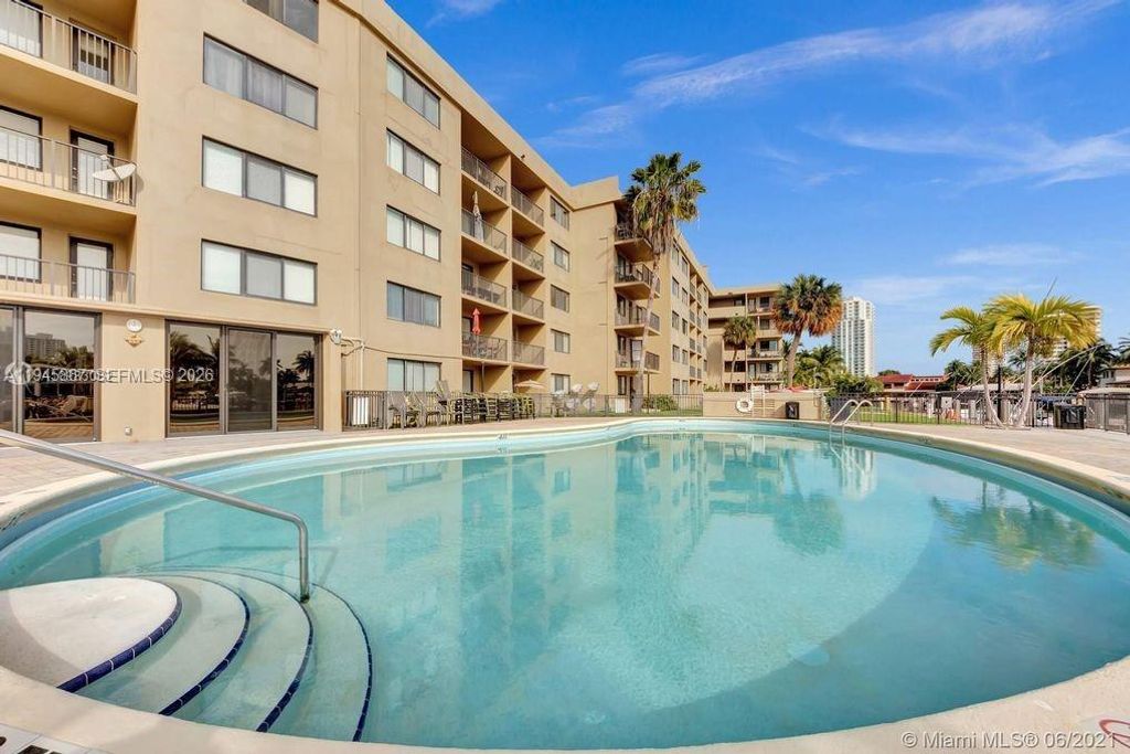 Photo of 301 Golden Isles Dr #205, Hallandale Beach, FL 33009 (MLS # A11945867)