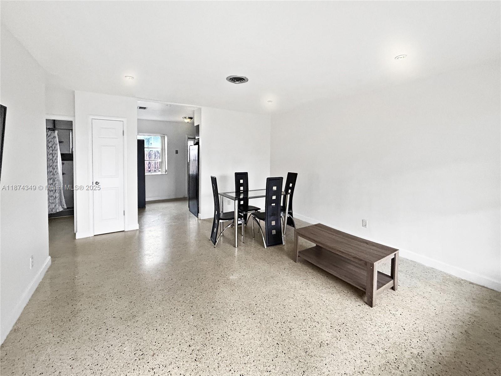 Welcome to this inviting 2-bedroom, 1-bath home located in a lovely Wilton Manors neighborhood. Enjoy a partial water view and timeless terrazzo floors that bring character and charm throughout. The home features a laundry room with full-size washer and dryer, fresh interior paint, and a private enclosed patio off the kitchen—perfect for relaxing or entertaining. This residence combines comfort and a prime location, offering the perfect opportunity to enjoy the sought-after Wilton Manors lifestyle.