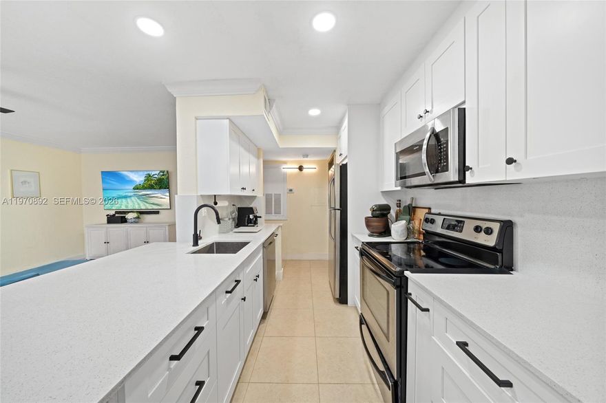 Discover the perfect blend of comfort and resort-style living with this updated 1-bedroom, 1-bathroom first-floor corner unit with 2 parking spaces. The open-concept design features tile flooring, a modern kitchen with updated cabinetry, an in-unit washer/dryer, and a renovated bathroom. Relax on your private screened-in balcony or take advantage of the gated community’s incredible amenities—tropical pool, fitness center, lake trail, and more. With two assigned parking spaces (a rare find for a 1-bedroom!), top-rated schools nearby, and strong investment potential, this home is as practical as it is inviting. Don't wait—schedule your private showing today! Special assessment of $773 until June 2026. Property CAN be rented since day one, perfect for investors.