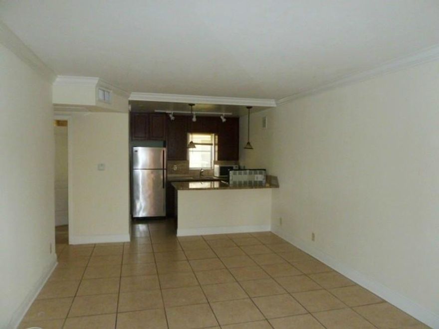 Located in Lake Ridge  just north of downtown Fort Lauderdale and Flagler village, this spacious renovated apartment has the perfect urban location. Hardwood kitchen, mosaic back splash, granite counter tops, renovated marble bathroom, crown molding, cent ral A/C and abundant closet space. The building has a pool, laundry facilities and an elevator and is very close to public transportation, governmental centers, Wilton Manors and the beaches. Building is under new management.