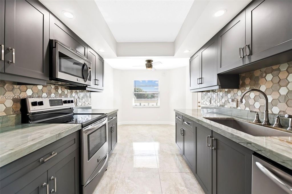 Photo of 1503 Cayman Way #C3, Coconut Creek, FL 33066 (MLS # A12015175)