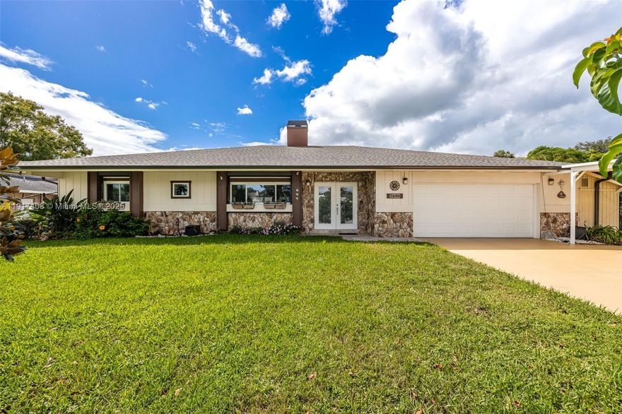 MINUTES TO THE CALOOSAHATCHEE RIVER — DIRECT GULF ACCESS!
Custom 2,240 sq. ft. pool home in a quiet neighborhood with vaulted ceilings, wood accents, stone fireplace, and a remodeled chef’s kitchen with pass-through to the lanai. Split-bedroom layout with updated baths and tile throughout. Major updates: HVAC (2023), roof (2023), carport (2022), lighting/fans (2022). Outdoors: heated saltwater pool (2016), expansive screened lanai with bar, new composite deck (2023), concrete dock, fenced yard, generator hookup, two sheds, and mature avocado trees. Elevated lot with low transferable flood insurance. A boater’s dream with quick access to open water!