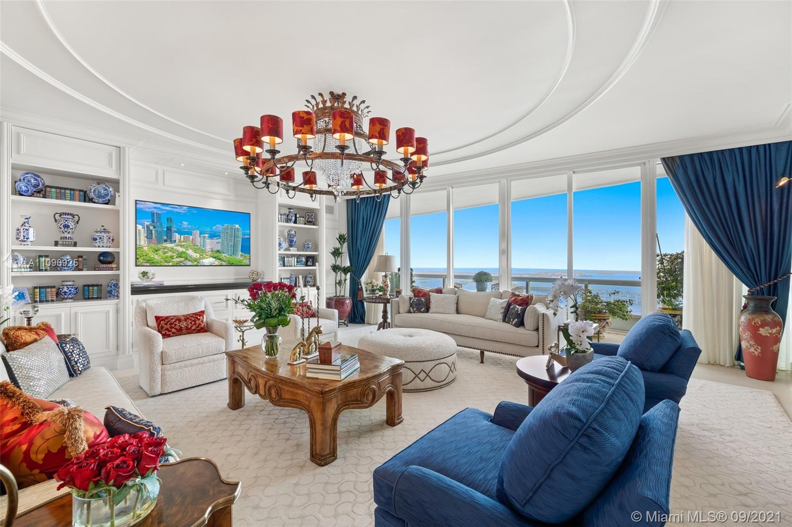 The best flow-thru plan in Santa Maria, residence 4205, sits on the 42nd floor with drop dead gorgeous views spanning from the bay to the city. Completely gutted and renovated and costing over $2 million, it is a must see. The unit offers an open concept kitchen with brand new, never used Gaggenau appliances, soundproofed interior walls, limestone floors in main areas, custom carpets in bedrooms, expensive custom millwork and surround sound system in every room. The glorious master bedroom has access to the east terrace and enjoys the most beautiful water views all the way to Key Biscayne. There is a well-appointed his and hers marble bathroom and a custom walk-in closet. The two additional bedrooms are en suite and open to the large west-facing terrace.