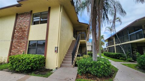 Photo of 10031 Winding Lake Rd #201, Sunrise, FL 33351 (MLS # A11875197)