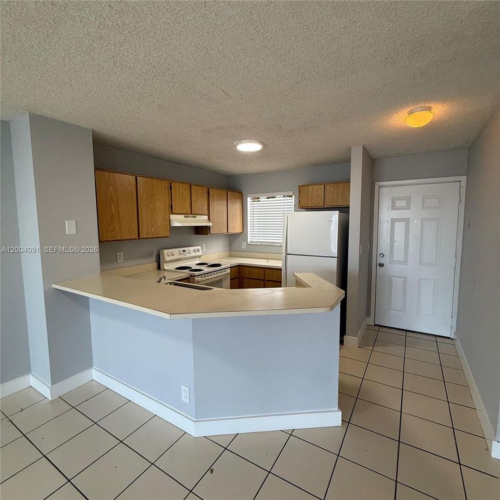 Photo of 8710 N Sherman Cr #305, Miramar, FL 33025 (MLS # A12004091)