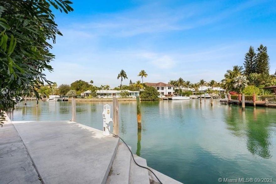 Exceptionally renovated waterfront island residence on most desirable turning basin of Cape Florida canal sits on an impressive 17,483 sq.ft. lot! No detail spared modernization was redone with the highest of standards. Some fine features include Brazilian Teak flooring throughout living and bedroom areas and marble flooring in top of the line kitchen area and adjacent grand family room with fireplace. High vaulted ceilings. Perfect home for those longing to enjoy the best of yachting.  Enjoy vistas of the waterway through all impact windows and doors that lead to the wonderful outdoor patio, pool, spa and of course a TWO-level dock with 123 ft seawall. Quick and easy access to Biscayne Bay and Atlantic Ocean- No bridges.