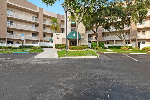 Photo of 9587 Weldon Cir #B403, Tamarac, FL 33321 (MLS # A11942481)