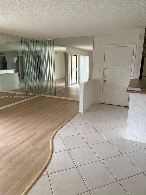 Photo of 10753 W Clairmont Cir #106, Tamarac, FL 33321 (MLS # A11975496)