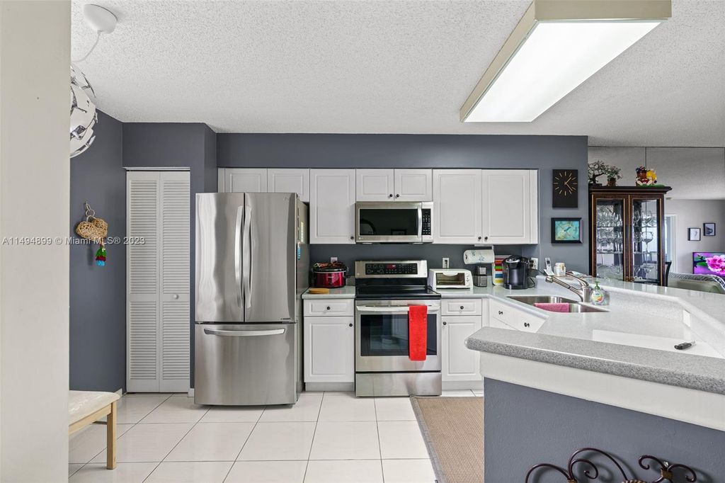Photo of 2334 S Cypress Bend Dr #806, Pompano Beach, FL 33069 (MLS # A11494899)