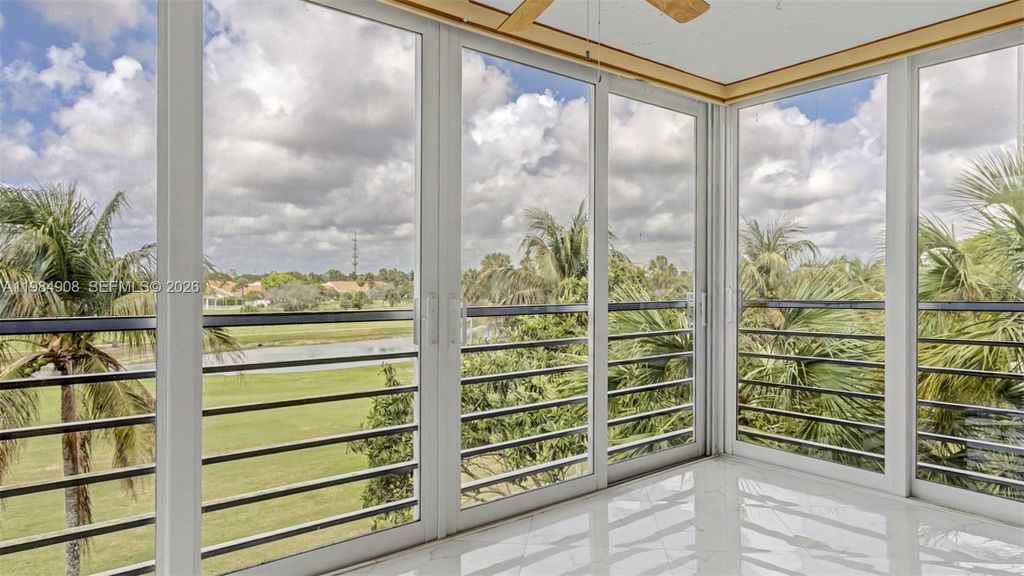 Photo of 3970 Oaks Clubhouse Dr #407, Pompano Beach, FL 33069 (MLS # A11984908)