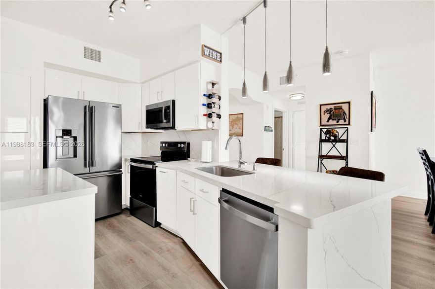 Elegance and grace define this lovely 2-bedroom | 2-bathroom condo in The Grande Condominiums. This large unit has been tastefully remodeled with modern touches and finishes. The kitchen is gorgeous and well appointed with excellent appliances to complement the quartzite countertops. The luxury-vinyl-tiles with their light wood-like finish provide a warmth that unites all of the living spaces. The bathrooms have also been updated while retaining the roman tub for the occasional bath. This unit boasts of two open balconies to enjoy - one off of the Dining Area, and another off of the Primary Bedroom. The Grande Condominiums is an excellent building with very professional property management, and it is so well located too! It's close to Dadeland Mall, adjacent to Baptist Hospital - Kendall Campus, and close to various major highways and thoroughfares (N. Kendall Dr, Palmetto, Don Shula, Snapper Creek Expressways, and the Florida Turnpike). You will love this property! Make an appointment and come to see it soon!!!