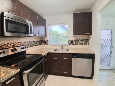 Photo of 9460 Sunrise Lakes Blvd #309, Sunrise, FL 33322 (MLS # A12036413)