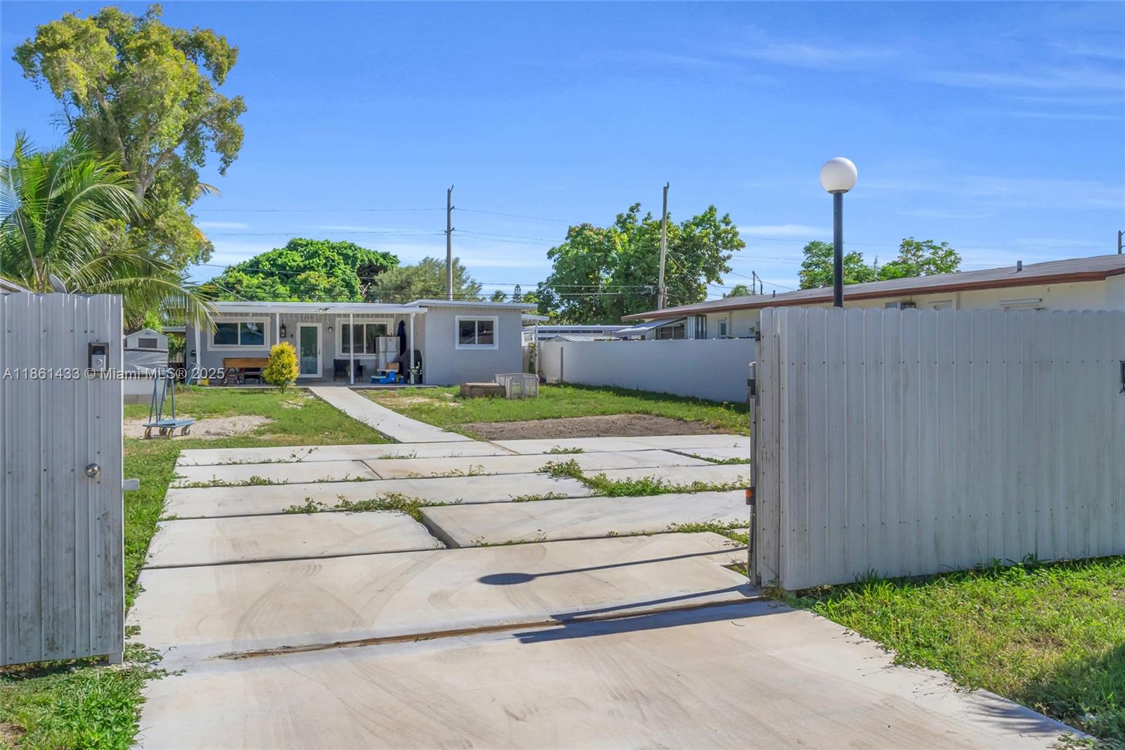 Charming 3/2 Home with a Huge front Yard ,New ROOF 2024,Impact Windows installed 2019 ,and A/C 2019 ,The property yard is perfect for outdoor activities, entertaining or for that extra space you were looking for your big Boat .Lets mention is fully fenced with double gate in the entrance .This Lovely property includes a Private In-Law Quarters ,ideal for guests, extra room or for income producing . This House has it all. Wont Last ,Call Today