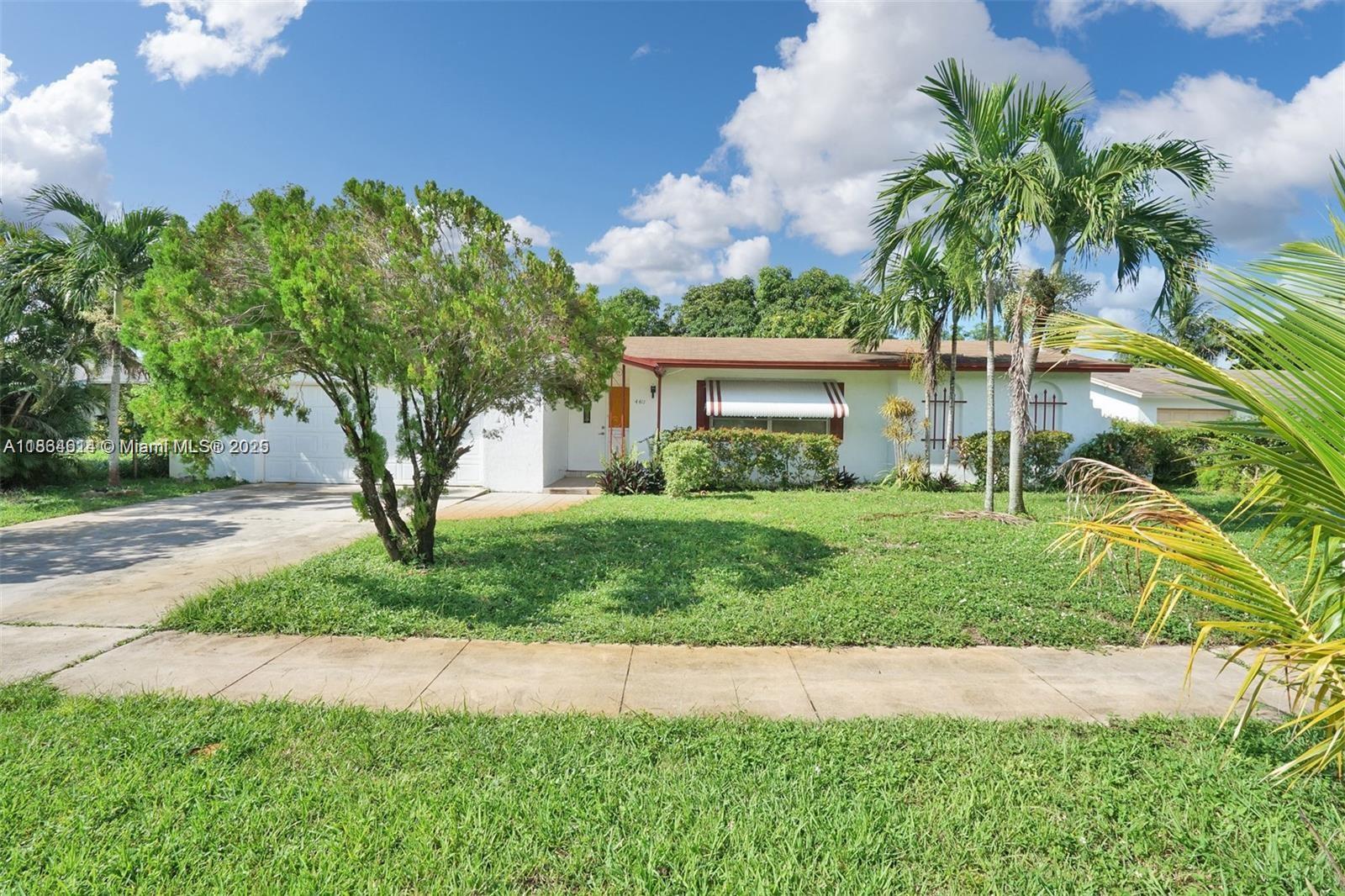 Discover this beautifully maintained 4BD | 2BA home with a 2-car garage, sitting on nearly 10,000 SQFT of land in the heart of Lauderhill! Step inside to an updated kitchen with stainless steel appliances, tile & laminate wood floors, and a spacious private family room perfect for entertaining. BRAND NEW HVAC, 2025. Enjoy South Florida living with an expansive backyard and front yard featuring a variety of fruit trees, including soursop, 4 mango trees, avocado, papaya, and banana. This home offers the perfect blend of comfort and convenience, located just minutes from 441 and the Florida Turnpike, with exciting developments and growth coming to the Lauderhill area. A true gem you DO NOT want to miss!