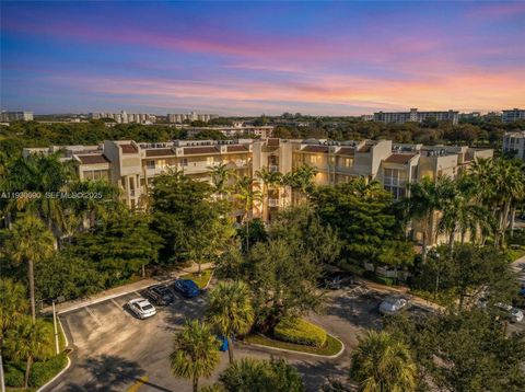 Photo of 3600 Oaks Clubhouse Dr #103, Pompano Beach, FL 33069 (MLS # A11930690)