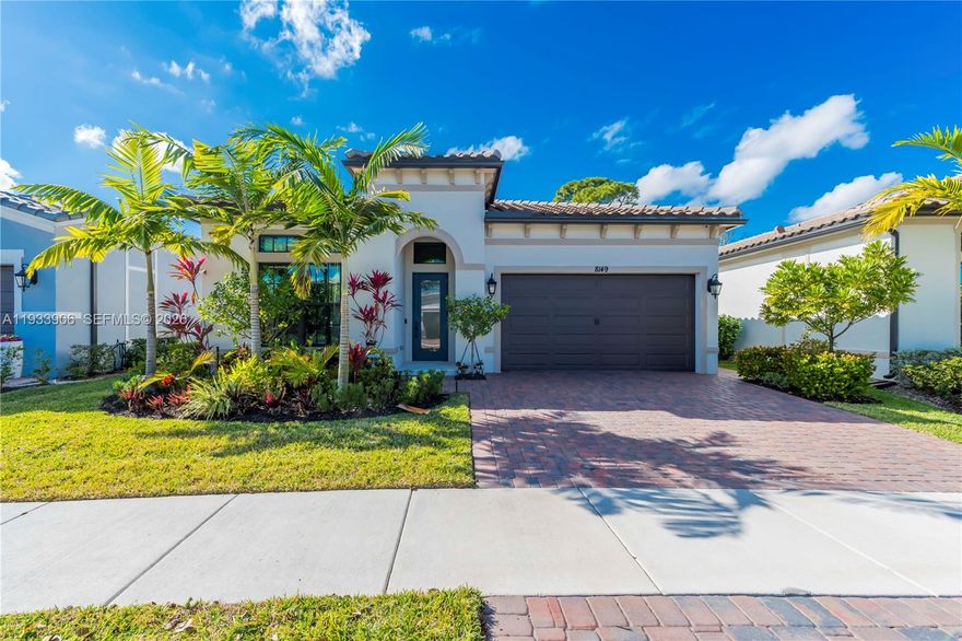 This upgraded 3-bedroom, 2-bathroom home offers an open, light-filled living and dining area that flows effortlessly into the kitchen, creating a welcoming space ideal for both everyday living and entertaining. Wood-tile flooring runs throughout with no carpet, while the thoughtfully designed kitchen features quartz countertops, tile backsplash, pantry, soft-close cabinetry with pull-out drawers, built-in garbage and recycling containers, a reverse-osmosis drinking water faucet, dedicated power outlets for small appliances, and a sleek vent hood. The layout continues seamlessly into spacious bedrooms, each enhanced with remote-controlled blinds, while custom built-ins add functionality throughout the closets and living areas. Sliding doors extend the living space outdoors to a peaceful, private yard with a screened and covered lanai, creating a calm setting perfect for relaxing. Additional highlights include Wi-Fi-enabled automated lighting, a whole-home water softener, EV charging in the garage, and access to resort-style community amenities including a clubhouse with theater, card rooms, billiards, ballroom, lounge, on-site café, fitness center, resort-style pool and spa, outdoor kitchen and lounge areas, pickleball and bocce ball courts, all within walking distance to houses of worship.