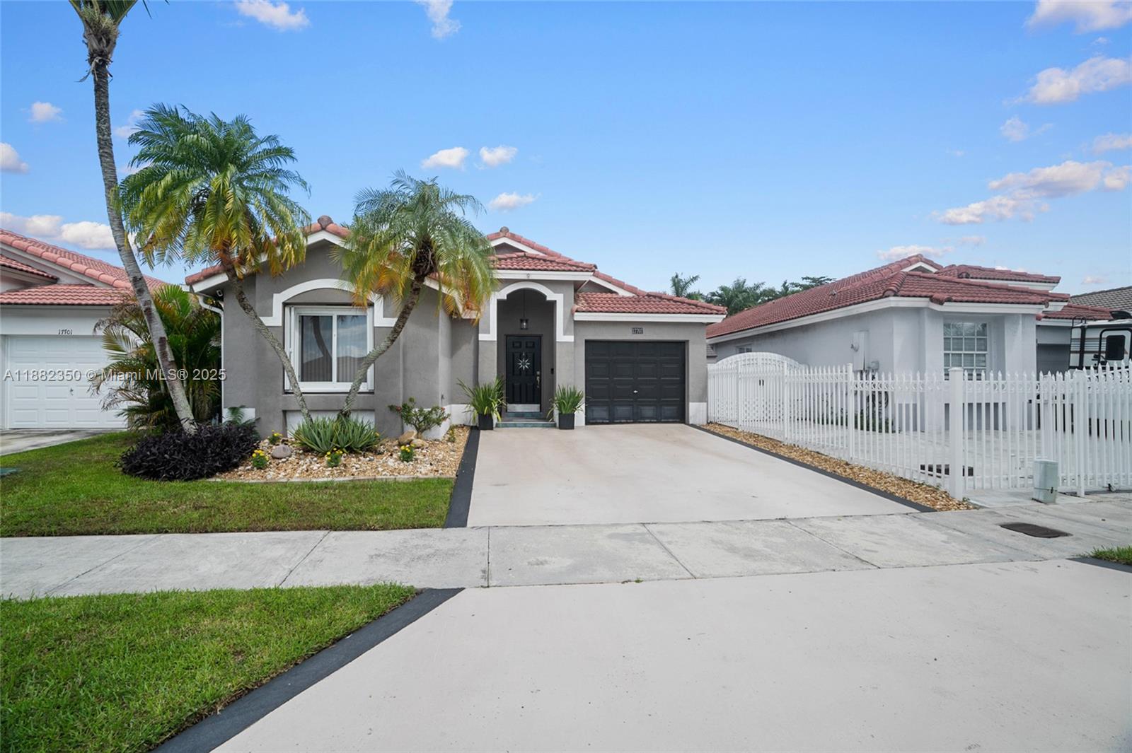 Beautifully updated 3-bedroom, 2-bathroom, 1-car garage home in a quiet family friendly neighborhood. Bright kitchen with updated appliances, renovated bathrooms, engineered hardwood floors, updated lighting and vaulted ceilings. Freshly painted inside and outside. Air conditioner is 6 years old and hot water heater is 5 years old. Complete impact windows and doors. Low maintenance fenced backyard featuring covered outdoor living space and artificial turf with no back neighbors. NO HOA. A-rated magnet school. Near Larry and Penny Thompson park, Miami zoo and easy access to major roadways.