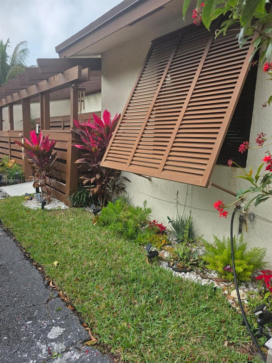 Well-maintained 3BR/2BA townhouse in Davie with tile flooring throughout, an updated kitchen, updated baths, impact windows, newer A/C and a recently replaced roof. A central atrium brings in natural light and offers a great space for plants. Clean and move-in ready with a practical layout, private patio, and room for a new owner to add personal touches over time. Conveniently located near parks, shopping, dining, Sawgrass Mills, and major roadways.