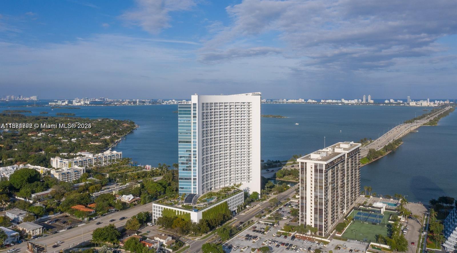 Discover luxury living in the Blue on the Bay,landmark designed by arquitectonica curved-glass high-rise cascades along Biscayne Bay in the vibrant edgewater/Midtown Arts District. Positioned between Downtown and Miami Beach, access to the Design District, Wynwood, Midtown, and major highways. 24-hour concierge and security, valet parking, lap and plunge pools, sundeck, spa and sauna, outdoor BBQ & lounge areas Clubroom/party room, media/movie theater, business and conference center,Elegant floor-to-ceiling high-impact glass windows and 9-ft ceilings spaces with light Italian cabinetry, granite countertops, S/S appliances, in-unit washer/dryer Panoramic Biscayne Bay & skyline views Spacious, private balcony. steps from shops, cafes, museums, galleries, Minutes to Miami Beach, the airport.