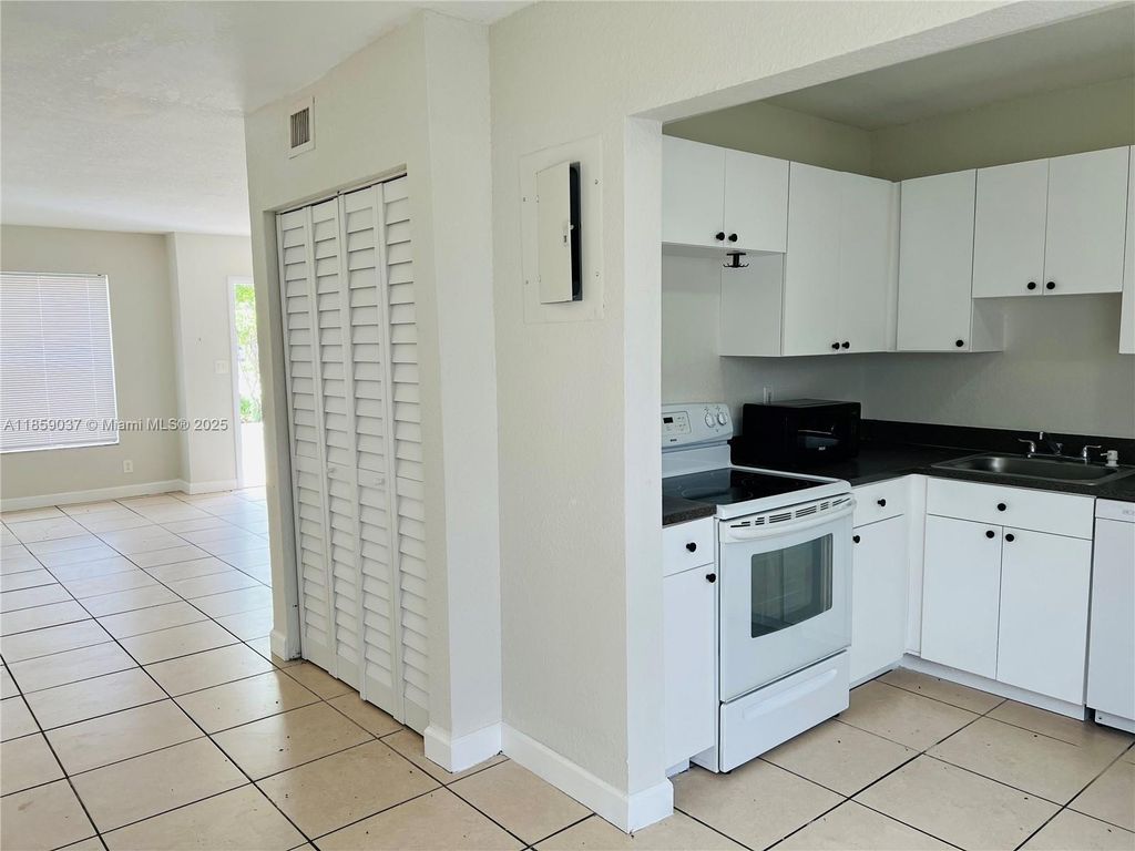 Photo of 4605 NW 9th Dr #4605, Plantation, FL 33317 (MLS # A11859037)