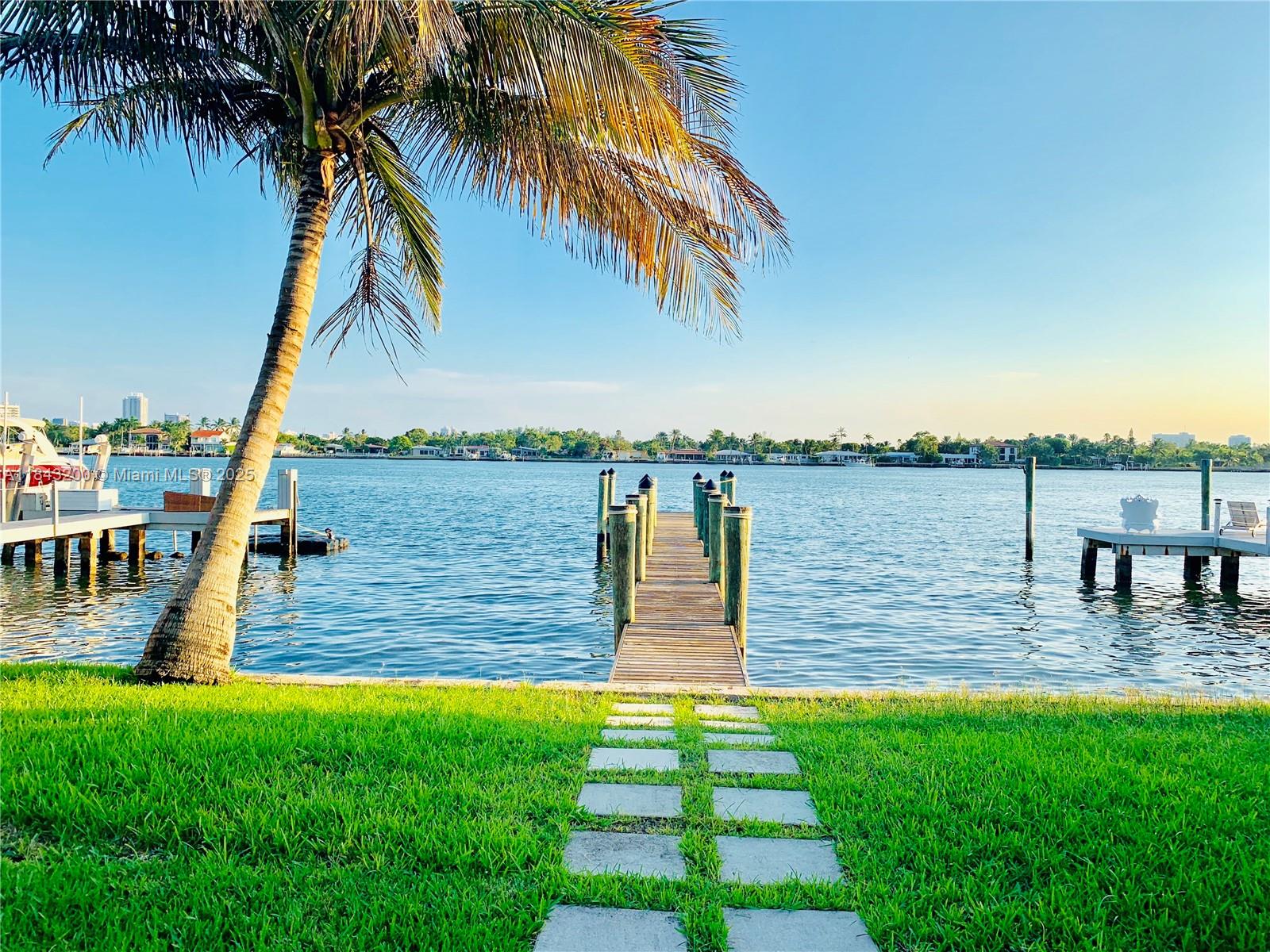 Welcome to your private waterfront oasis in the heart of Miami Beach! This stunning 4 bed, 3 bath home blends modern elegance with relaxed coastal living. Enjoy serene water views from the open-concept living and dining areas, featuring floor-to-ceiling impact windows and abundant natural light. The chef's kitchen boasts premium appliances, sleek cabinetry, and quartz countertops. Step outside to your lush tropical paradise with a sparkling pool, spacious patio, and 50 feet of water frontage—perfect for entertaining. The primary suite offers private access to the backyard retreat. Ideally located near beaches, Bal-Harbor Shopping and dining, and top-rated schools. This gated island community on a Cul-de-sac street has 24/7 surveillance. Available furnished or unfurnished.