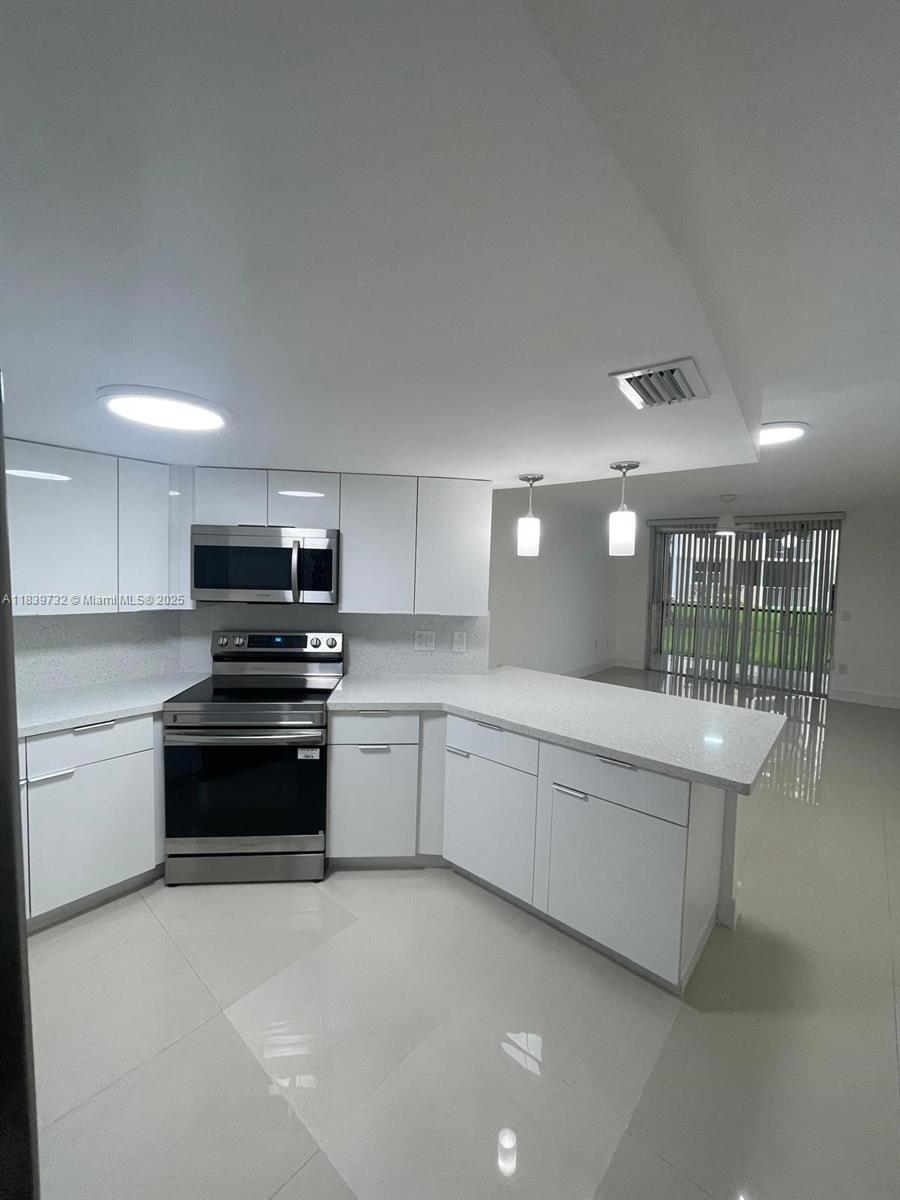Beautifully updated and spacious 1 bedroom, 1 bath condo available for immediate rent in the highly sought-after community of Las Vistas at Doral. This bright and inviting unit features a brand-new remodeled kitchen with sleek cabinetry, quartz countertops, and stainless steel appliances. Both bathrooms have been tastefully updated with modern finishes for a clean, contemporary feel. Enjoy tile flooring throughout, a split-bedroom layout for added privacy, generous closet space, and the convenience of an in-unit washer and dryer. Relax on your private balcony  with storage or take advantage of the gated community’s excellent amenities. Ideally located close to shopping, dining, and major highways. Move-in ready – don’t miss this opportunity!
