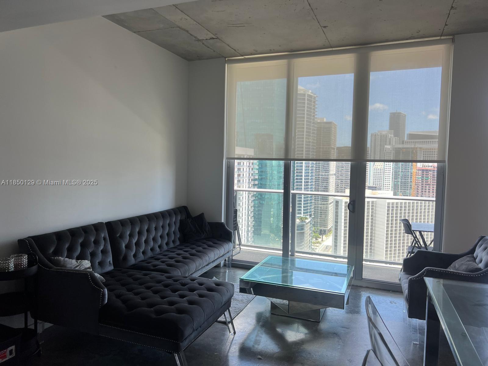 Fantastic location in the heart of Downtown Miami, located just a few blocks from the Metro Mover, Miami Riverfront, Bayfront Park and Bayside Market, Miami Worldcenter and famous American Airlines Arena. This stunning loft-style apartment boasts oversized windows that flood the space with natural light. 10-foot ceilings make the apartment more luxurious. Basic cable and Internet is included. The building has a nice rooftop pool and gym. Unit features floor-to-ceiling glass windows, an open layout with concrete flooring, stainless steel kitchen appliances, tons of cabinet space, front-loading washer and dryer, roller shades and balcony with city and partial water views.