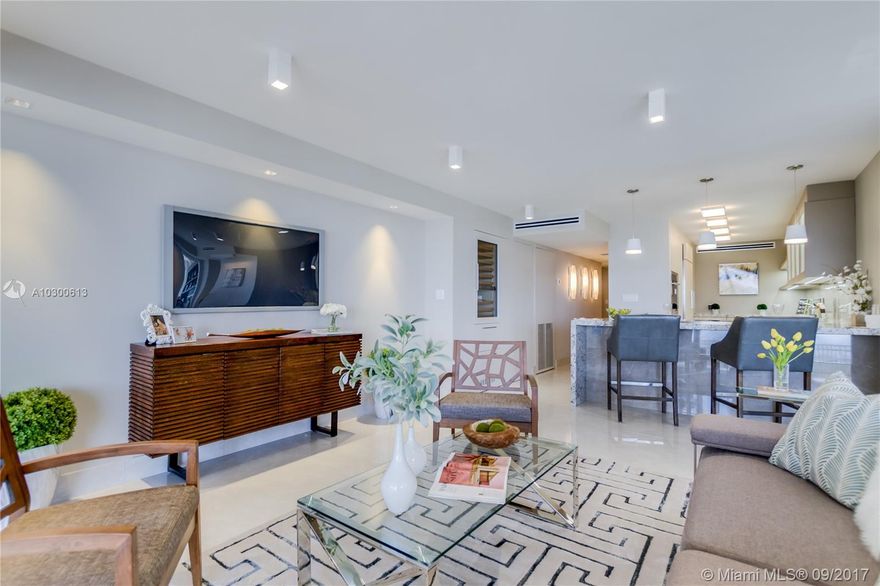 Beautiful Coconut Grove condo in a classy, secure, centrally-located building. Made totally new by discerning owners with no expense spared. Completely renovated using top quality materials, craftsmanship and taste – from a Snaidero kitchen to high-impact, sound-absorbing doors. Great view and location and competitive with much higher priced condos. Exquisite closets, built-in home office, perfect flow for entertaining with 500 square feet of balcony showing bay and Grove/Coral Gables views, spectacular at night. Never occupied, owner transferred. You will have no renovation headaches because it's already done, with great taste. Recertification assessment is already prepaid. Monthly maintenance fees only $1,340. 3 bedrooms (1 converted to office), 2 full baths, custom closets.