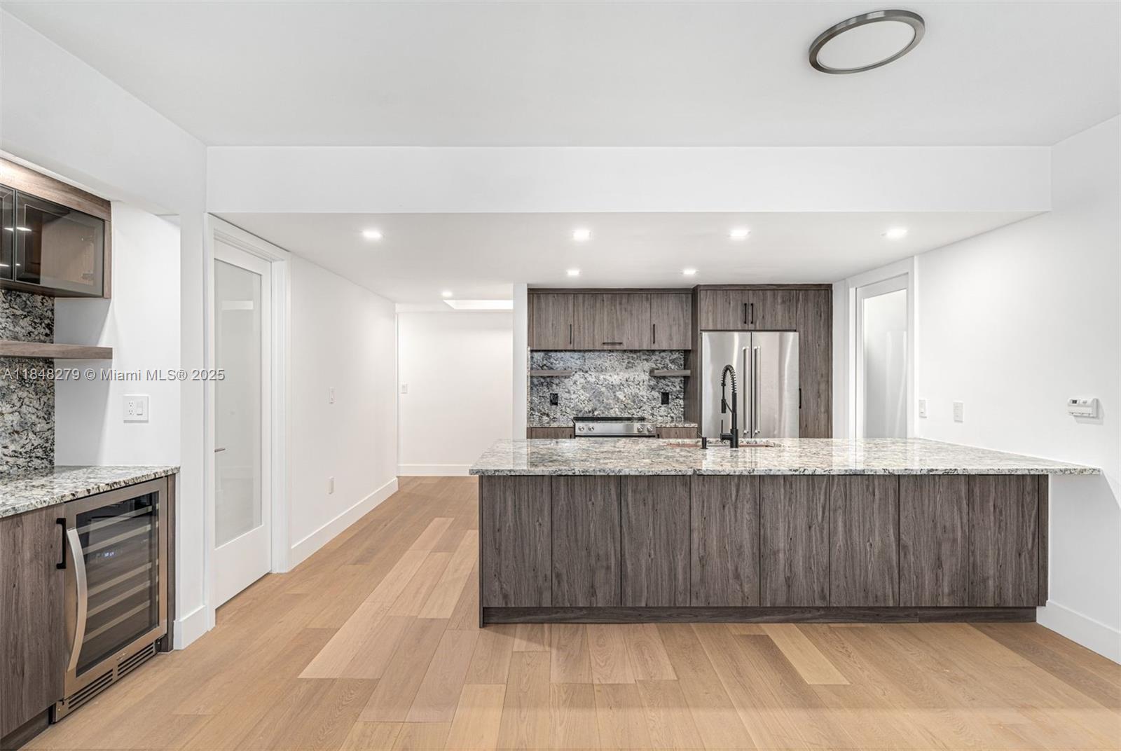 Be the first to live in this beautifully renovated corner unit at 50 Biscayne! New floors, kitchen + appliances, window treatments, and bathroom/closet cabinetry. Floor plan has been reimagined to utilize the space more efficiently, adding in a bar area with wine fridge next to kitchen. Work/storage area has also been added in primary suite. 50 Biscayne is a full service building with a private lap pool, fitness center, sauna/steam rooms, pilates room, and more. Walk to Whole Foods, Julia & Henrys, great dining such as Tam Tam, Metro Mover, and Brickell. Across from Bayfront Park. Easy access to Miami Beach, Brickell, Midtown and Airport via car. 1 assigned parking space. Residents may elect to valet an additional vehicle for a monthly fee.