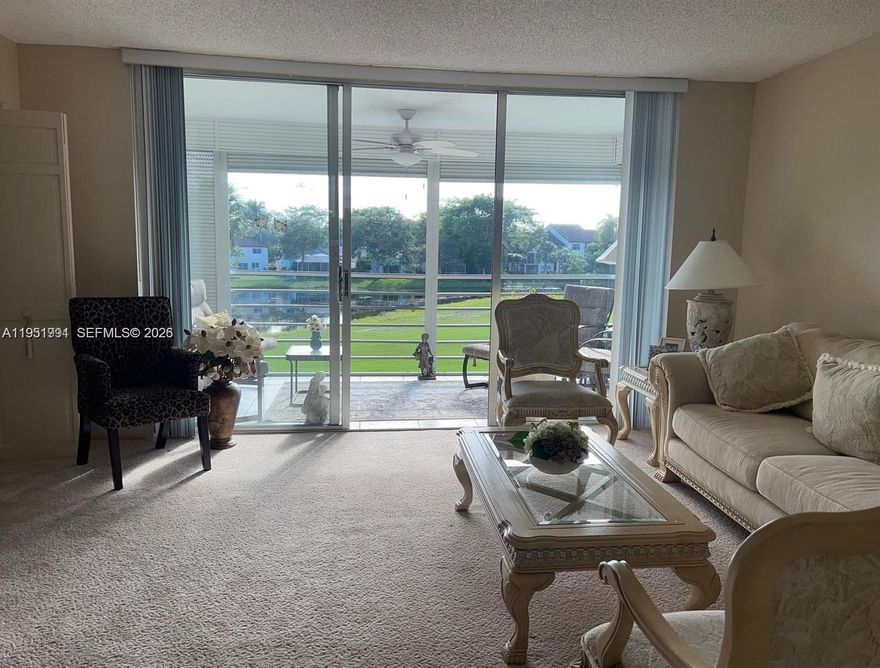 Prime corner 3BD/2BA residence featuring one of the largest wraparound balconies in the building with serene water and golf course views. Bright and spacious layout with extra windows and abundant natural light throughout. Expansive living and dining areas ideal for entertaining family and guests, seamlessly connecting to the oversized balcony for indoor-outdoor living. Large kitchen with ample cabinet and counter space. Primary bedroom offers a walk-in closet and a comfortable, private retreat. Corner unit provides added privacy and a highly desirable floor plan. Assigned parking included. Move-in ready and well suited for a primary residence, or investment opportunity.