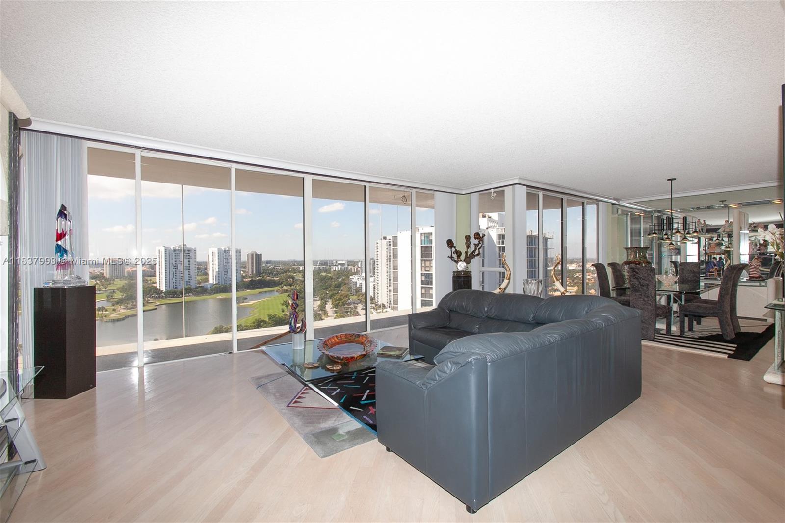 ENTER THROUGH DOUBLE DOORS & SEE THE BEST VIEWS OF THE GOLF COURSE, INTRACOASTAL, & CITY. SPACIOUS 1800SF CORNER UNIT W/WRAPAROUND BALCONY FOR SUNSET VIEWS. FINISHES INCLUDE WOOD FLOORS, GRANITE COUNTERS, ITALIAN MURANO, CUSTOM CLOSETS. NEW CUSTOM KITCHEN W/ALL NEW APPLIANCES, NEW BATHROOMS. SPACIOUS SPLIT BEDROOM PLAN.
RESORT STYLE AMENITIES: POOL WITH HUGE DECK & BBQ, GYM, MEDIA RM, LIBRARY, EVENT ROOM, ENTER CLUB HOUSE TO THE SECOND POOL ON THE INTRACOASTAL, NEW GYM, SAUNA, SPA, RACQUETBALL & TENNIS COURTS, KIDS ROOM, CARD RM, ROOM SERVICE, FULL MOVIE THEATER, ALSO CAFE WITH OUTDOOR SEATING & MUCH MORE! CLOSE TO AVENTURA MALL, RESTAURANTS, CASINOS, 5 MIN TO THE BEACH, NEAR 2 INT'L AIRPORTS. NEXT TO SOFFER EXERCISE TRAIL ON GOLF COURSE.