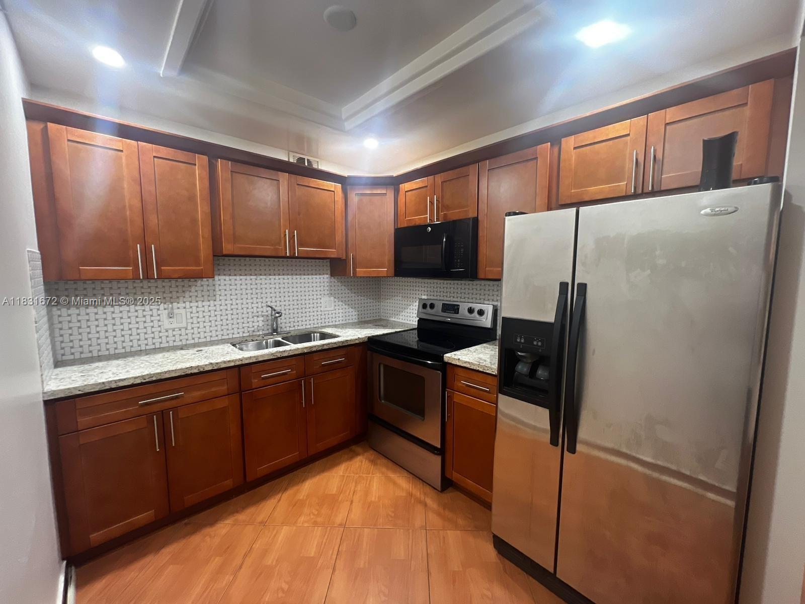 Discover the ultimate 55+ lifestyle in this beautifully updated 2-bedroom, 1.5-bathroom apartment in the prestigious Century Village of Pembroke Pines! This home boasts a stunning kitchen, perfectly complemented by elegant laminate flooring. The bright, features large windows, flooding the space with natural light and creating an inviting ambiance. Century Village offers 5-star amenities, including a world-class clubhouse, sparkling pools, tennis courts, golf, a fitness center, theater, and countless social activities. Convenient shuttle services provide easy access to nearby shopping, dining, and entertainment. With 24-hour security, this residence combines comfort, style, and resort-style living. Schedule your private tour today and start living your dream lifestyle!
