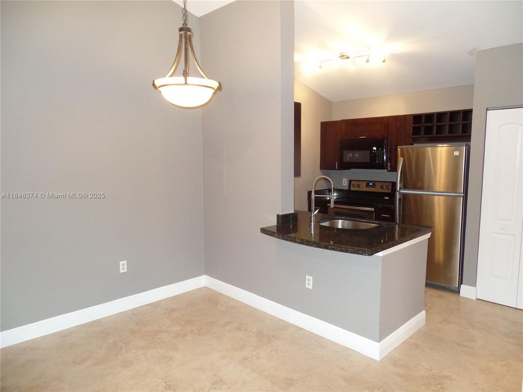 Photo of 2820 N Oakland Forest Dr #306, Oakland Park, FL 33309 (MLS # A11846374)