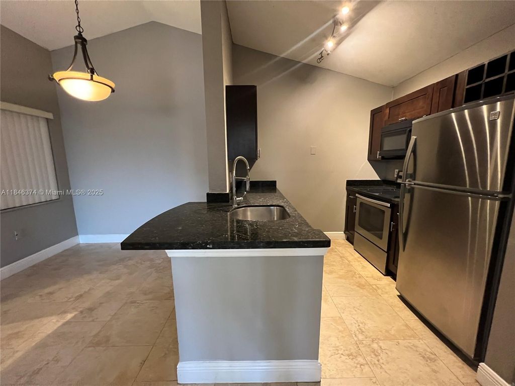 Photo of 2820 N Oakland Forest Dr #306, Oakland Park, FL 33309 (MLS # A11846374)