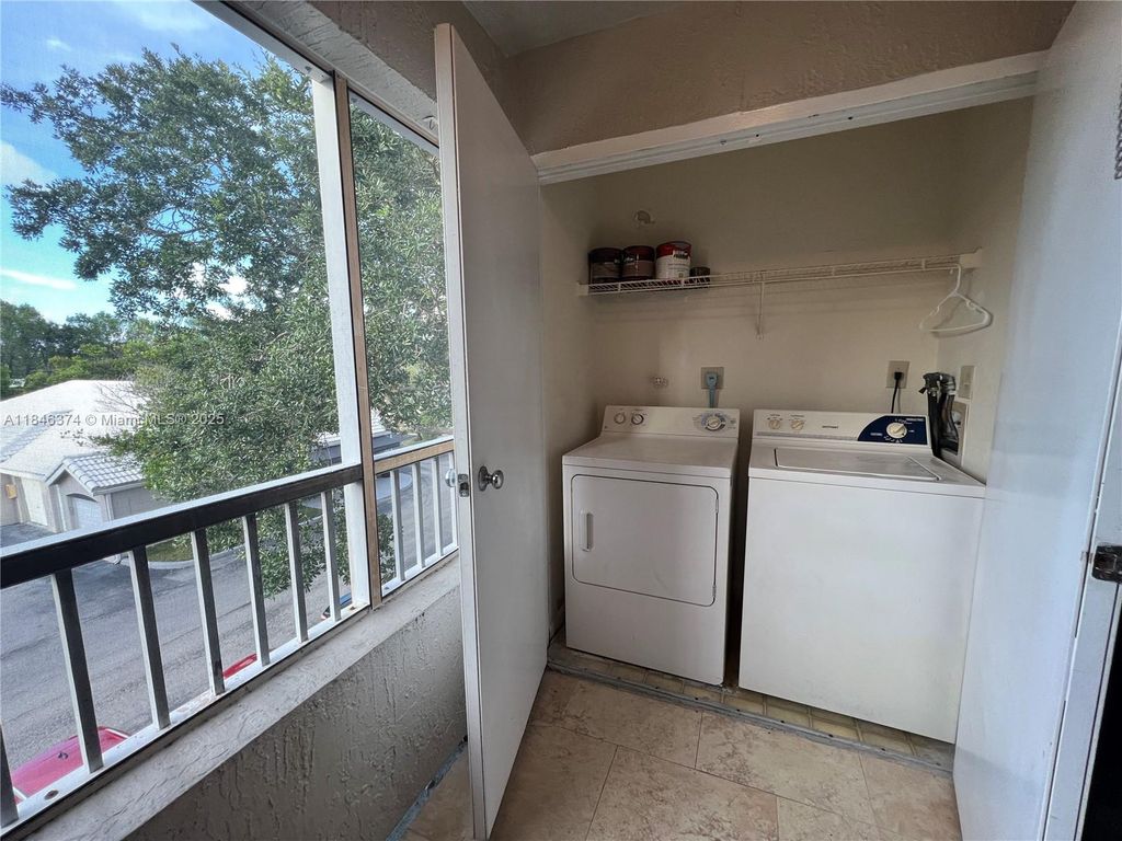 Photo of 2820 N Oakland Forest Dr #306, Oakland Park, FL 33309 (MLS # A11846374)