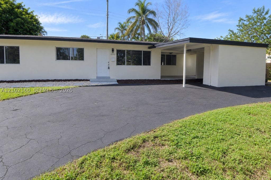 Photo of 1201 NE 26th Ter, Pompano Beach, FL 33062 (MLS # A12102160)
