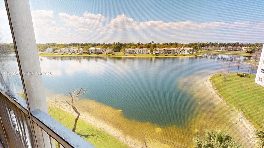 Perched on the 5th & top floor of exclusive Captiva Condo A in Doral, this beautifully upgraded 3-bdr, 2-bth, ~1,700 sqft residence delivers sweeping, unobstructed lake views & the rare luxury of no neighbors above — absolute penthouse-level tranquility. Freshly renovated w/ brand-new laminate floors in all bdrs, fresh white paint throughout, updated bathrooms, refreshed kitchen countertops & all-new appliances incl. washer, dryer & dishwasher — truly move-in ready. Open-concept split-floor layout flows across porcelain marble floors, anchored by a contemporary kitchen w/ granite countertops & SS appliances. Principal suite features spa-inspired en-suite w/ bidet, dual sinks & sep. tub/shower plus balcony access. Dedicated in-unit laundry & 1 assigned parking incl. Water incl. in fees. Screened balcony frames breathtaking lake views year-round. Protected by multi-layered security incl. guarded entrance & 24-hr patrol. Full access to world-class island clubhouse w/ resort pools, gym, tennis & basketball courts, cabana, children's play area & private sandy beach. Mins from top-rated schools, premier shopping, major hwys & MIA airport — exceptional opportunity in one of Doral's most coveted communities.