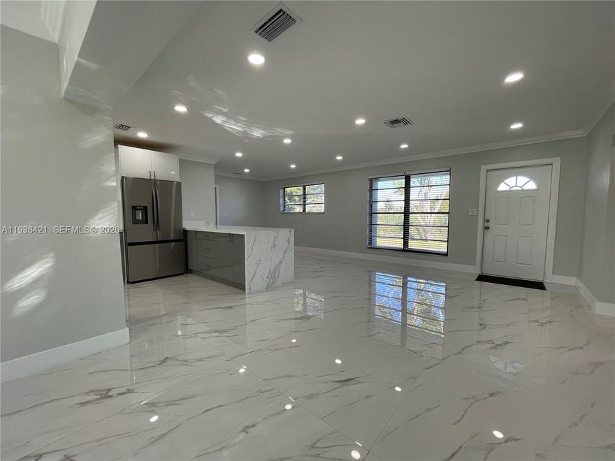 Beautifully nearly 2,000 sq ft remodeled home. Huge 7,800 Lot with space for a pool. 4-bedroom, 2-bathroom single-family home in North Miami Beach, near places of worship, parks, and scenic waterways. This move-in-ready residence features a stunning primary bathroom, and a walk-in closet. The fully updated kitchen showcases 2 sinks, quartz countertops, new appliances, and upgraded plumbing and electrical throughout. Interior living space is approximately 300 sq ft larger than tax records reflect. Enjoy a huge backyard ideal for entertaining, a circular driveway with ample parking, and a prime location close to everyday conveniences. A rare blend of style, space, and location. Call today to schedule your appointment. See and feel your future home!