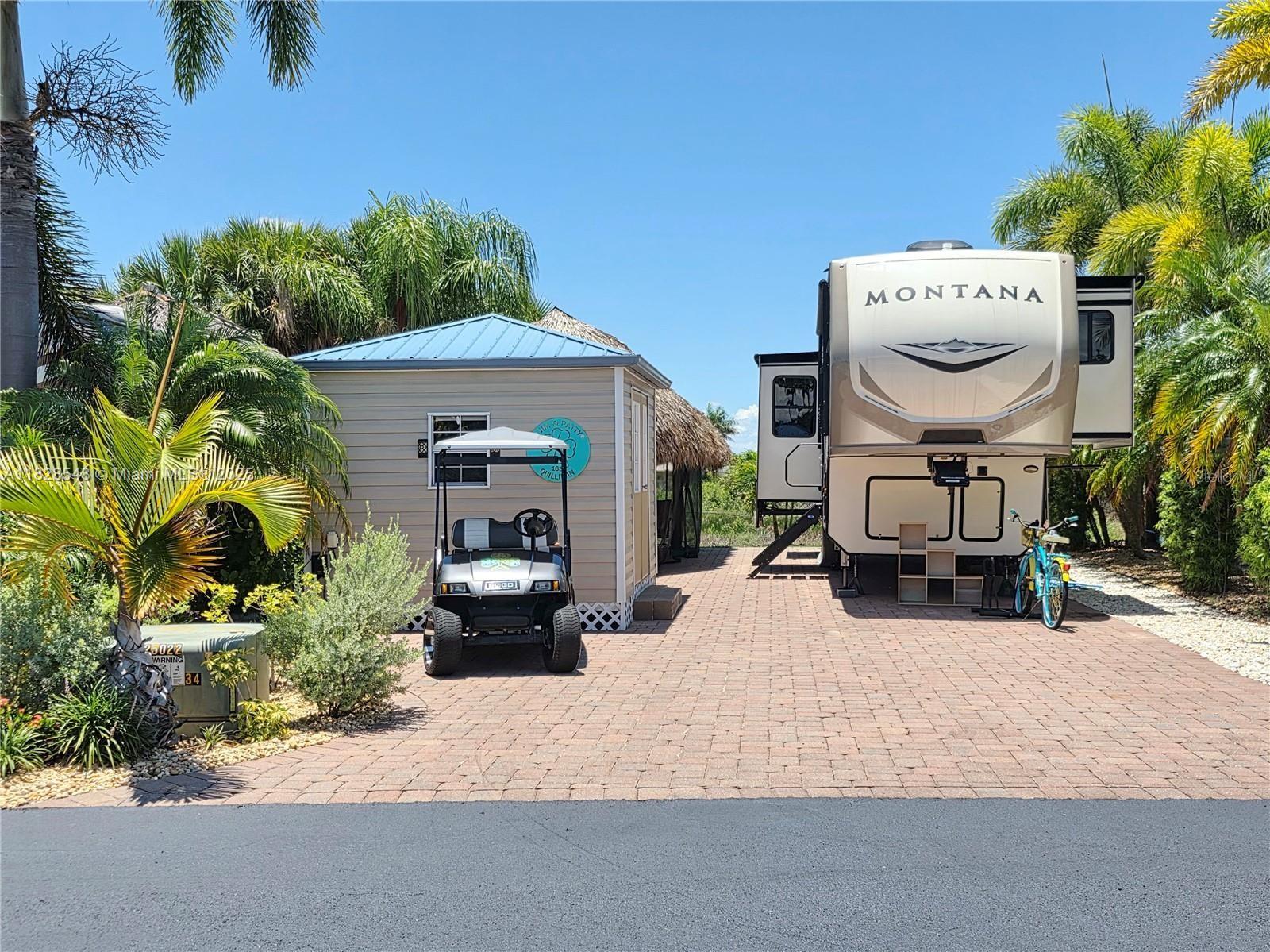 SILVER PALMS 5 STAR RV RESORT - This beautiful property is on the preserve that is teeming with wildlife in the rainy season. The landscaping is superb. Sitting in your Tiki in the evening watching the spectacular sunsets, the Tiki is all screen in for your comfort. The Tiki is 10x28, Casita is 10x12 and you can build to your own specifications. The property includes a 2020 Montana 5th Wheel. It has hydraulic jacks, pantry, washer/dryer. This is an active resort with 9 pickleball courts, clubhouse, heated pool, Jacuzzi, poolside bar and grill, fitness center, billiards room, fitness center, card room and much more. Golf cart comes with the package, all six batteries were replaced in December 2024. Roof on camper redone in December 2024. Right across from the clubhouse. Perfect location.