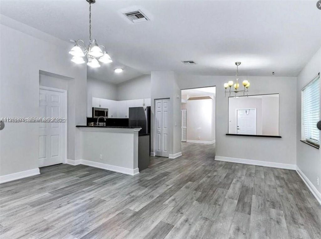 Photo of 1213 SW 46th Way, Deerfield Beach, FL 33442 (MLS # A11978326)