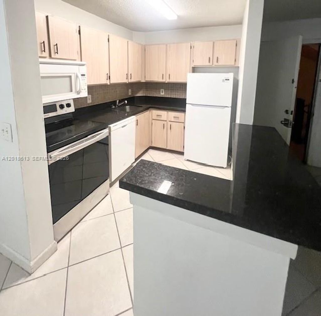 Photo of 10717 Cleary Blvd #206, Plantation, FL 33324 (MLS # A12018613)