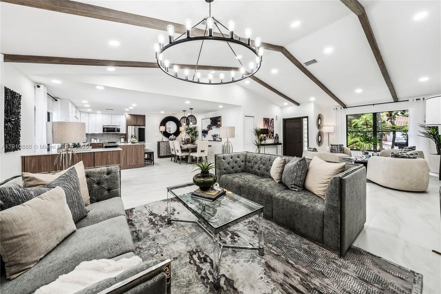 BACK ON MARKET DUE TO SELLER FINANCING THROUGH. Welcome to your dream home in the heart of Coral Springs! This stunning 4BD/2BA pool home has been beautifully renovated w/ high end finishes & thoughtful upgrades throughout. Enjoy an open-concept layout w/wood beamed ceilings, brand new floors, LED lighting & designer chandeliers. The kitchen features quartz countertops, S.S. appliances & an island with custom cabinetry. Both bathrooms have been fully remodeled w/ modern finishes. The spacious primary suite offers a walk in closet & spa like bathroom. Step outside to your private oasis complete with a sparkling pool, pizza oven, built in BBQ & mango trees. Nest A/C & 7 year old roof.  Conveniently located near top rated schools, parks, dining & shopping. Don't miss this one of a kind gem!