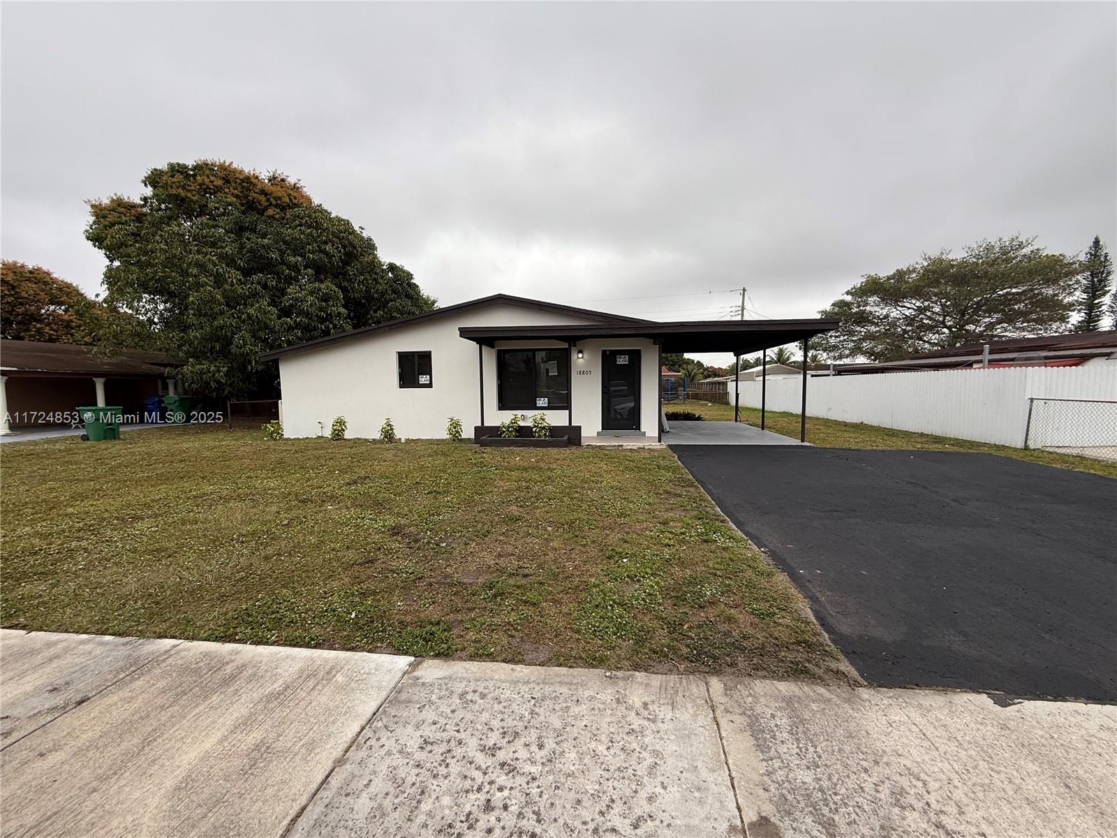 Completely rehabbed home with new impact windows and appliances. large yard with space for pool.
