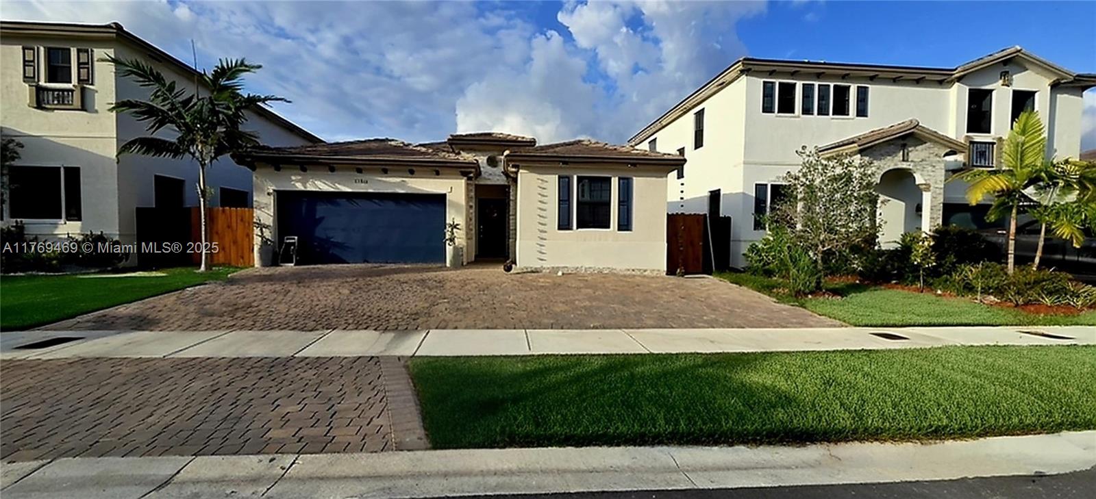 This single-story home features a privately situated bedroom off the foyer, while another bedroom can be found off the living and dining space. The living room, dining room and kitchen conveniently share an open layout that promotes effortless flow between spaces, while a hallway leads to the luxe owner's suite.