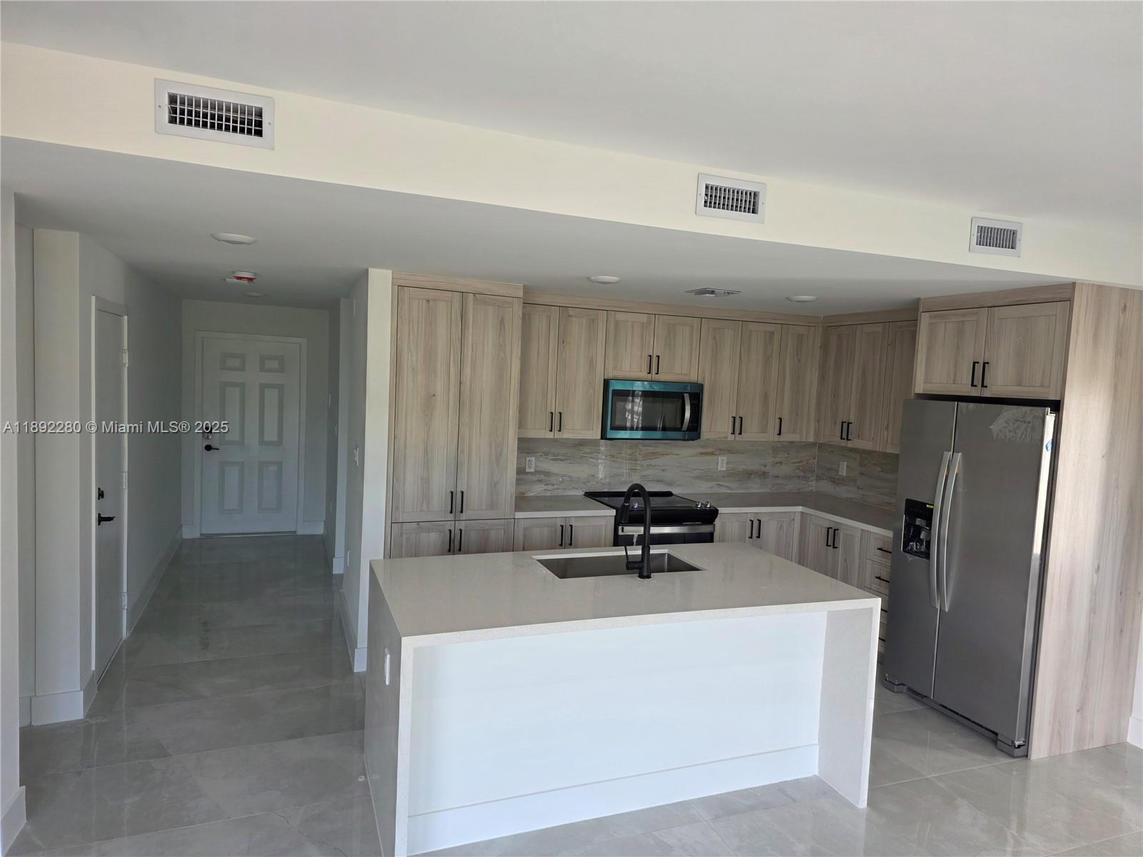 Luxurious Brand new full concrete home perfect for a family to enjoy and live safely with brand new stainless steel appliances, impact windows and impact doors, California style closets, quartz bathroom and kitchen counter tops, double sink bathrooms, Island style kitchen, Tesla charger, cameras and security system already installed, large garage, 5bedroom and 3 full bathroom (independent door in 1st floor bedroom). Beautiful balcony to sip your morning coffee from, fenced patio, washer/dryer (laundry room) and paved driveway. Lot's of parking space, near the Turnpike. Be the first to live in this beautiful GEM (price negotiable) won't last! CALL LISTING AGENT NOW