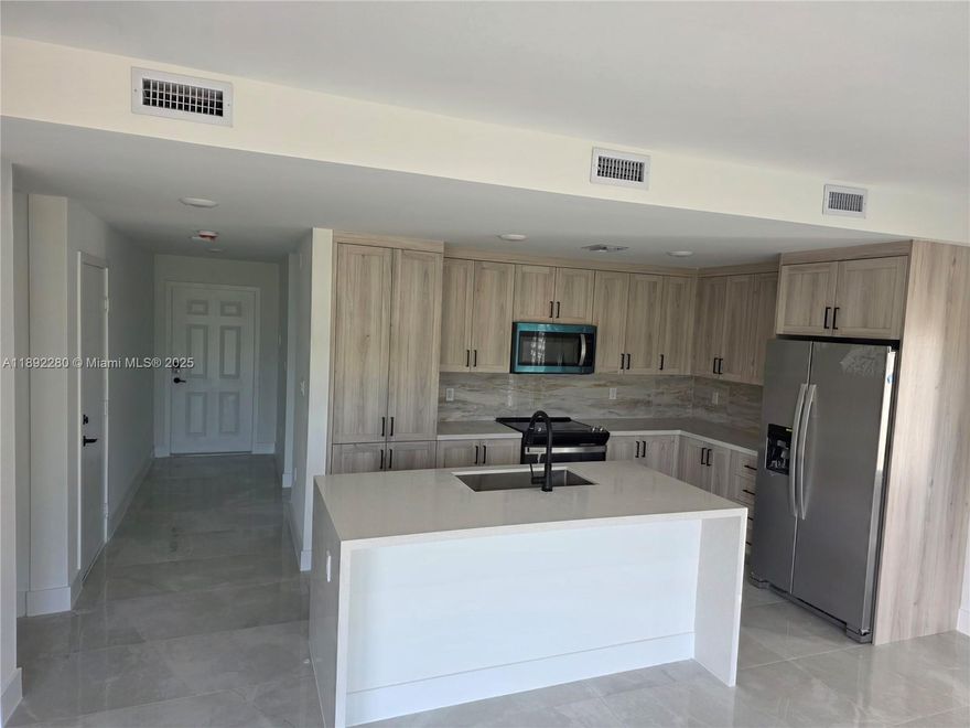 Luxurious Brand new full concrete home perfect for a family to enjoy and live safely with brand new stainless steel appliances, impact windows and impact doors, California style closets, quartz bathroom and kitchen counter tops, double sink bathrooms, Island style kitchen, Tesla charger, cameras and security system already installed, large garage, 5bedroom and 3 full bathroom (independent door in 1st floor bedroom). Beautiful balcony to sip your morning coffee from, fenced patio, washer/dryer (laundry room) and paved driveway. Lot's of parking space, near the Turnpike. Be the first to live in this beautiful GEM (price negotiable) won't last! CALL LISTING AGENT NOW