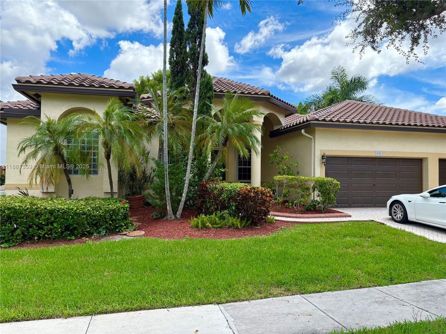 Stunning & spacious 5BR/3BA Mediterranean-style home with 2,924 SF living area, 3-car garage + 2 outdoor spaces. Open layout filled with natural light. Located in Pembroke Isles, a gated community with resort-style amenities: clubhouse, 3 pools, tennis, pickleball, basketball, volleyball, soccer, fitness center, jacuzzis & children’s play area. HOA includes lawn care, sprinklers, alarm & basic cable. A+ rated schools. Available now – easy showings!