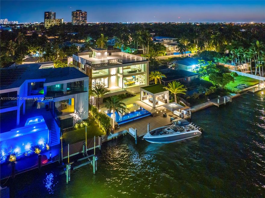 Welcome to Villa Q - Located bayfront on the double gated Belle Meade Island, this 4-level new construction is a symbol of modern opulence. Built in 2022, this home integrates luxury and refined functionality with a 14-car garage, elevator, soundproof theater, infinity pool, summer kitchen, outdoor dining area, and 75’ of water frontage w/ dock. The open-concept second level raises the bar for living and entertaining, featuring expansive water views, Italian porcelain floors, wine cellar, custom built-ins and lighting, and 2 terraces. The third level has 4 bedrooms all with en-suite bathrooms and walk-in closets, 2 of which have built-in drop-down projector screens. The fourth floor opens to a roof terrace with stunning views of the bay and Miami. Welcome to your dream home in paradise.